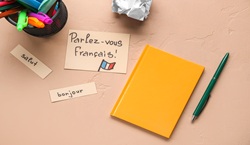Notebook, stationery and words 'Parlez-vous Francais'