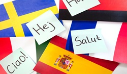 Hello in different languages and the corresponding flags